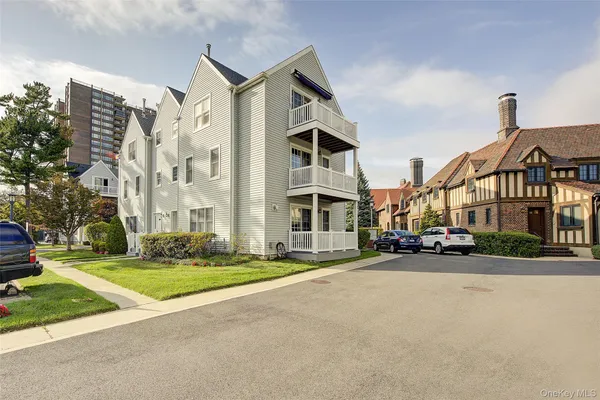 a view of a street with a building in the background