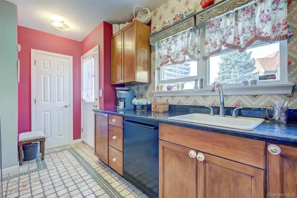 a kitchen with stainless steel appliances a sink stove and cabinets