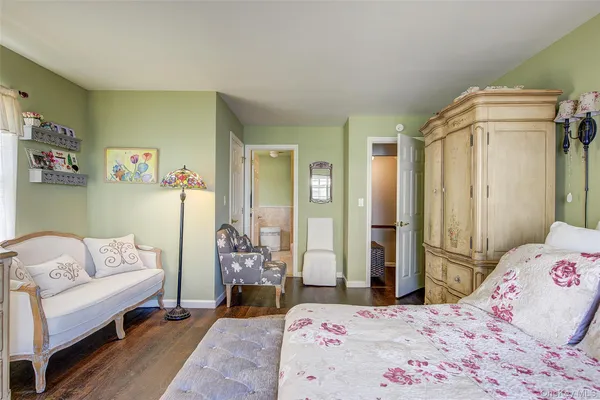 a bedroom with a bed and a couch