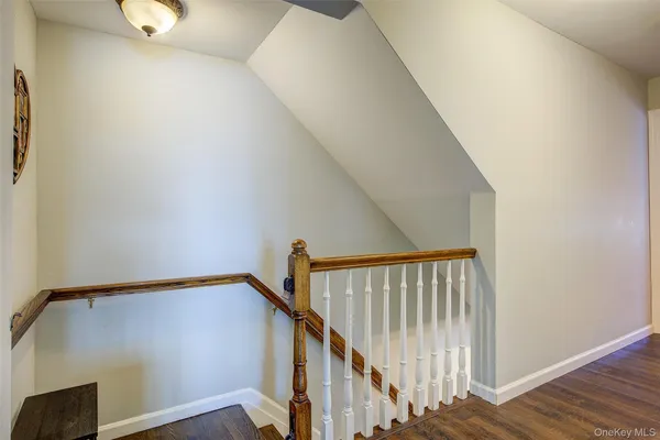 a view of entryway with wooden floor