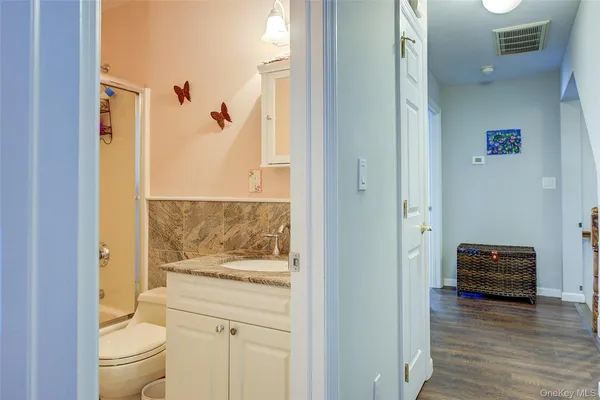 a view of bathroom and bathroom with wooden floor