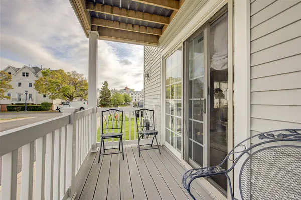 a view of balcony with furniture