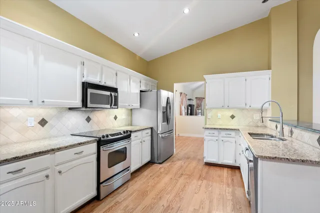 an aerial view of a house with swimming pool