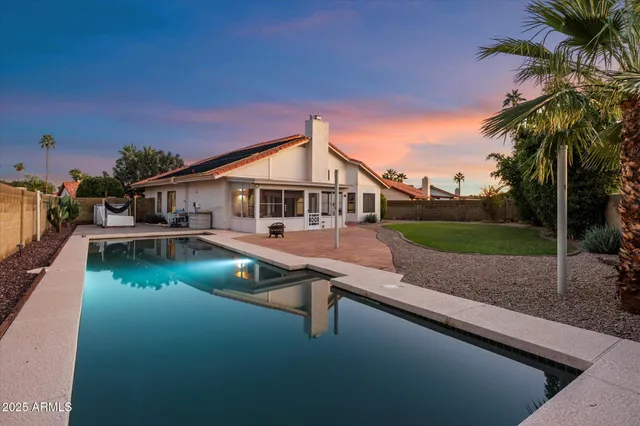an aerial view of multiple houses with a yard