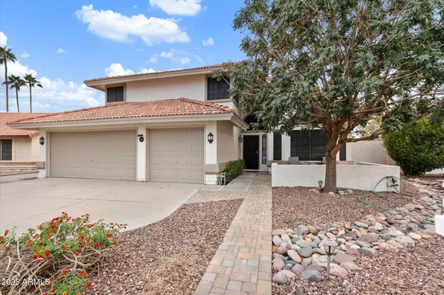 a view of a room with wooden floor and staircase