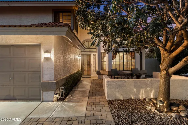 a kitchen with stainless steel appliances granite countertop a sink and a stove top oven