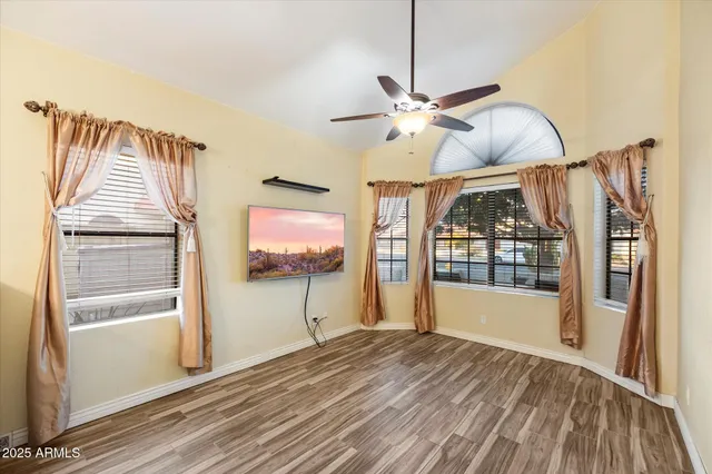 a large kitchen with stainless steel appliances a large counter top a stove a chimney a sink and a large window