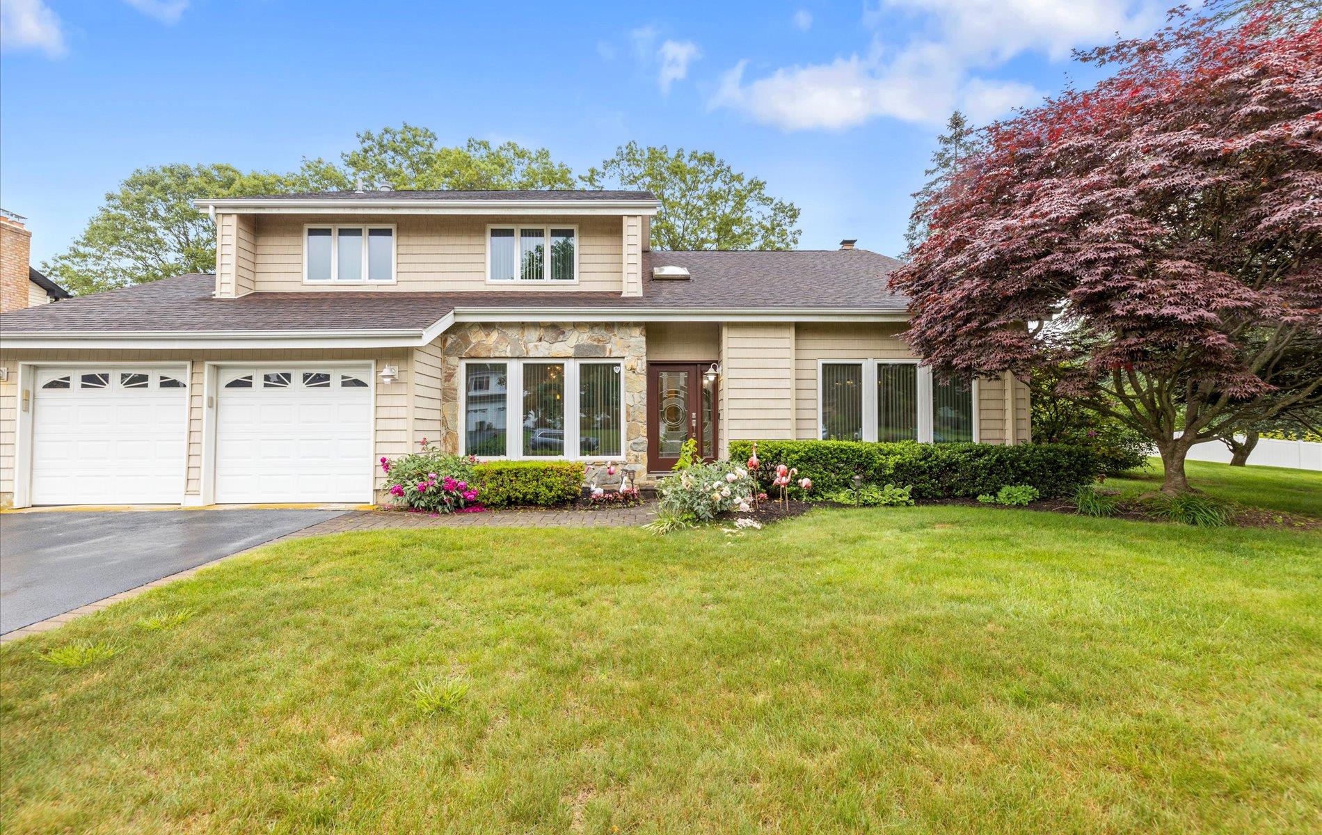 34 Oak Meadow Road Commack, NY 11725 - Photo 1 of 1 front view of a house with a yard