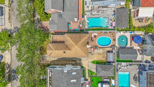 an aerial view of a house with a swimming pool