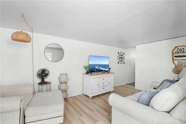 a bedroom with a bed and window with bathroom