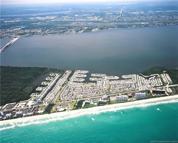an aerial view of a house with outdoor space