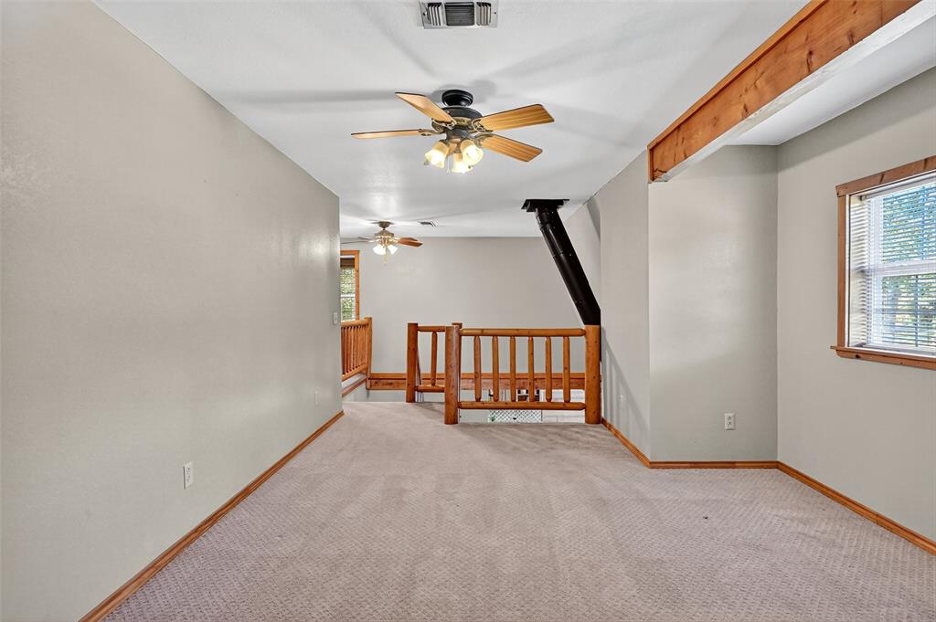 570 Ayres Road Bells, TX 75414 - Photo 26 of 39 Carpeted empty room with a ceiling fan and baseboards