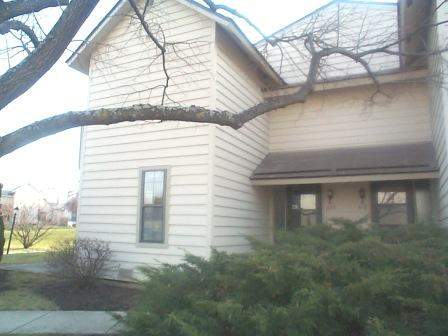 620 Dunham Road, Unit 620 Gurnee, IL 60031 - Photo 1 of 1 a view of a house with a yard