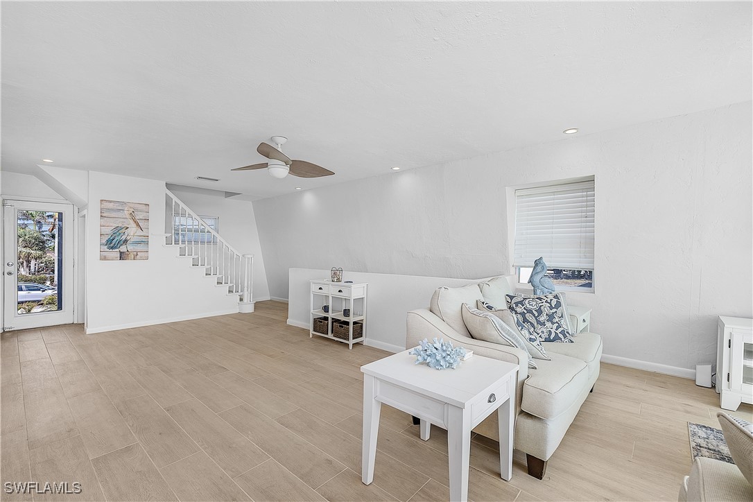 3128 Stringfellow Road St. James City, FL 33956 - Photo 14 of 50 a living room with furniture and kitchen view