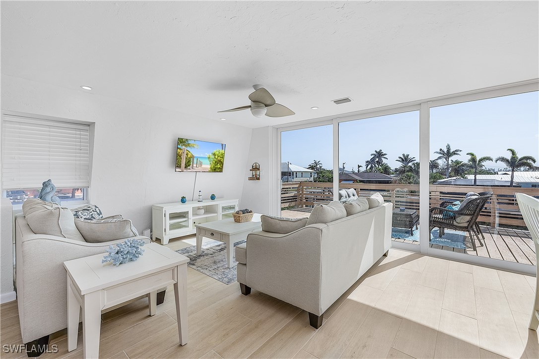 3128 Stringfellow Road St. James City, FL 33956 - Photo 15 of 50 a living room with furniture and a table