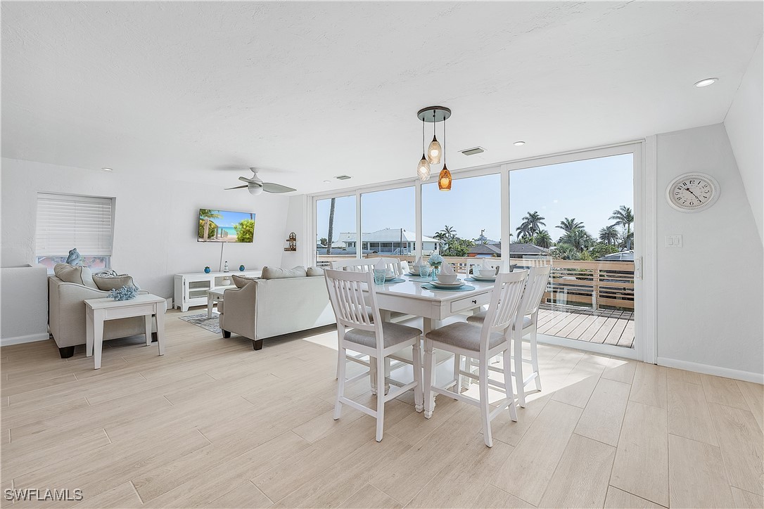 3128 Stringfellow Road St. James City, FL 33956 - Photo 16 of 50 a view of a dining room with furniture and a window