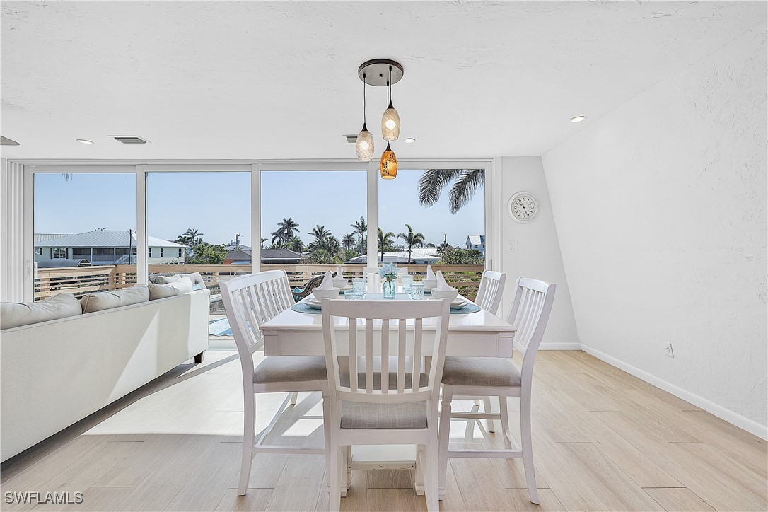 3128 Stringfellow Road St. James City, FL 33956 - Photo 17 of 50 a view of a dining room with furniture window and outside view