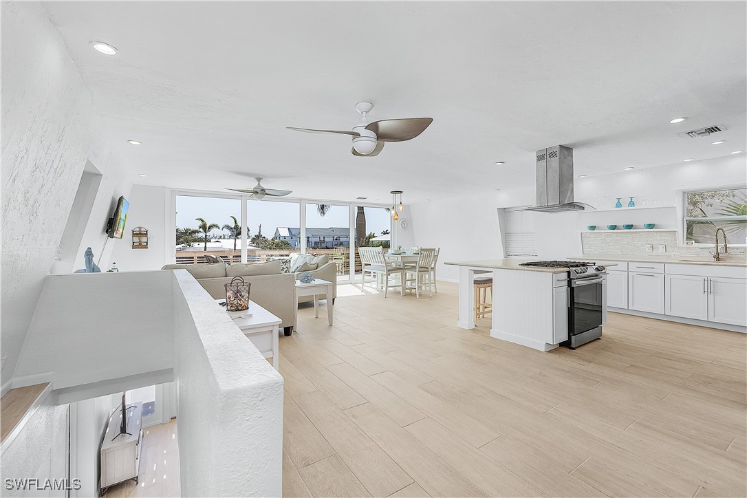 3128 Stringfellow Road St. James City, FL 33956 - Photo 18 of 50 a large kitchen with lots of counter top space and appliances