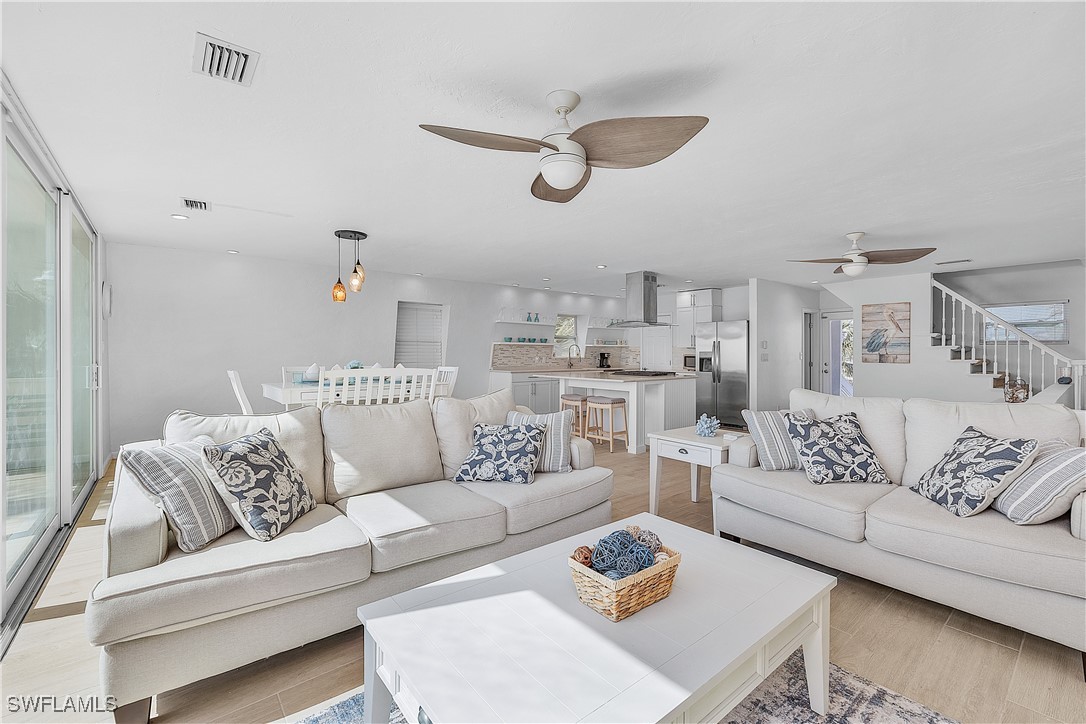 3128 Stringfellow Road St. James City, FL 33956 - Photo 20 of 50 a living room with furniture kitchen view and a table