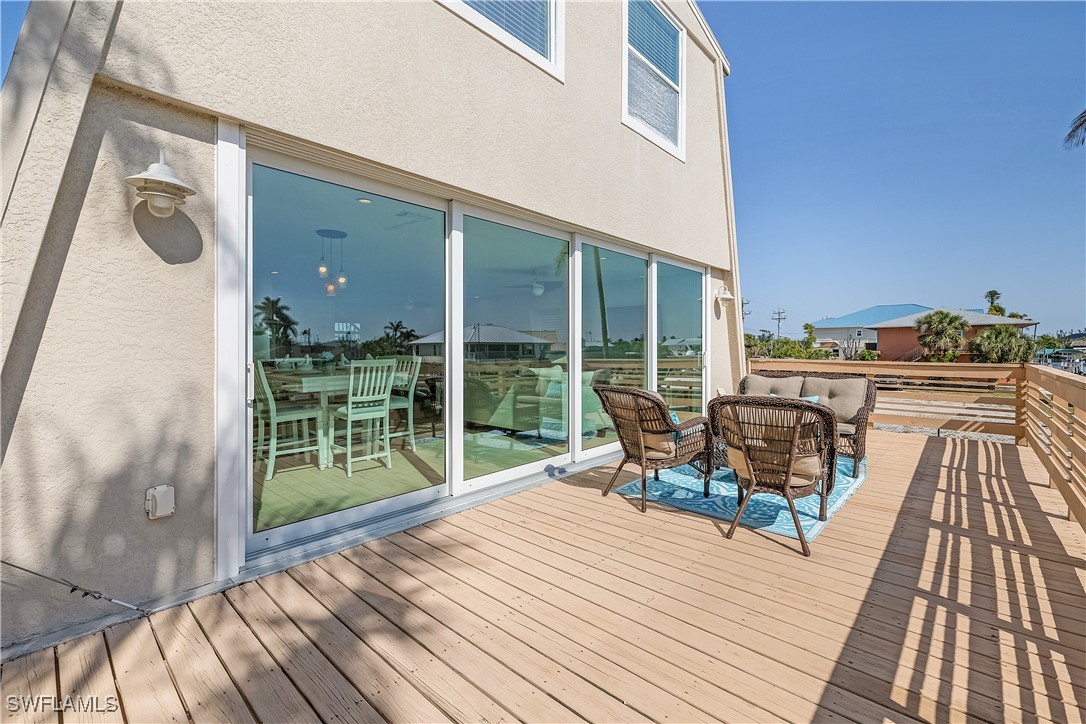 3128 Stringfellow Road St. James City, FL 33956 - Photo 22 of 50 a deck view with a seating space