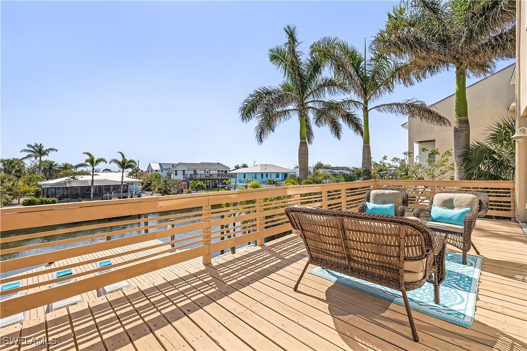 3128 Stringfellow Road St. James City, FL 33956 - Photo 23 of 50 a view of a terrace with furniture and city view