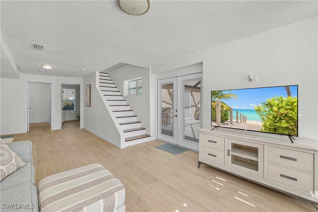 3128 Stringfellow Road St. James City, FL 33956 - Photo 34 of 50 a view of a livingroom with furniture and staircase