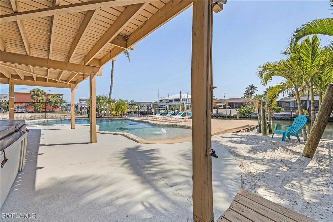 3128 Stringfellow Road St. James City, FL 33956 - Photo 40 of 50 a view of a swimming pool with a patio