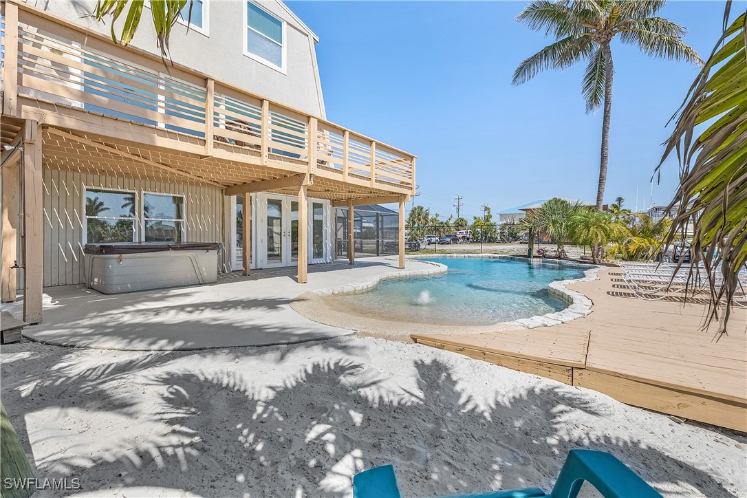 3128 Stringfellow Road St. James City, FL 33956 - Photo 43 of 50 a view of a building with a yard