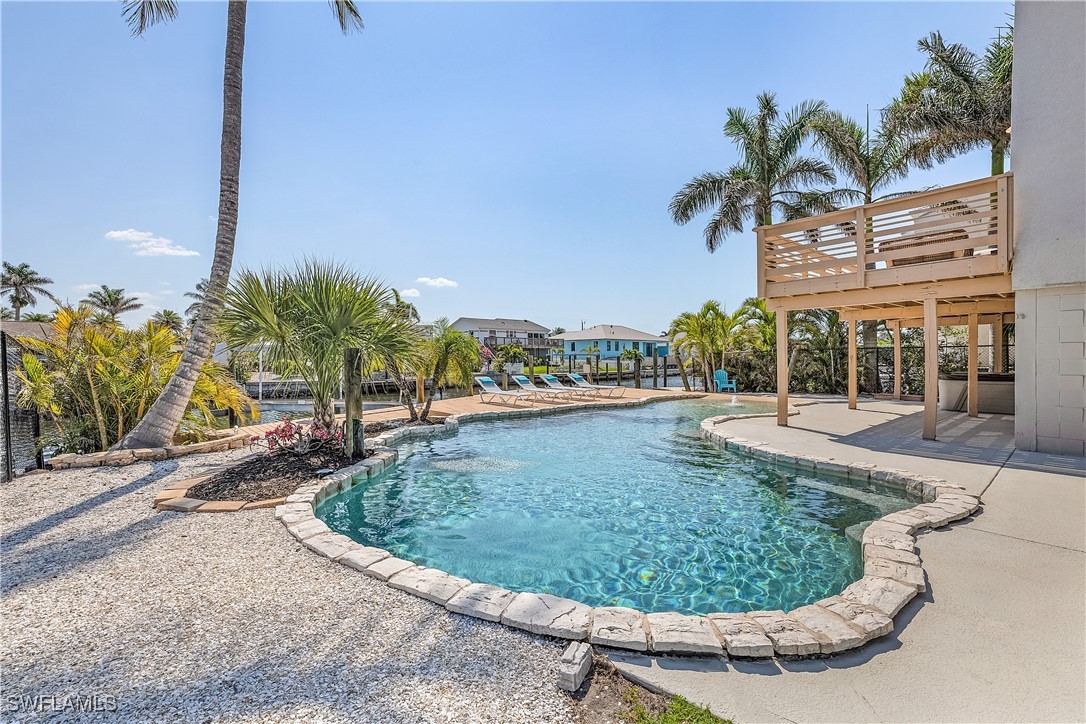 3128 Stringfellow Road St. James City, FL 33956 - Photo 44 of 50 a view of a swimming pool with a sitting space