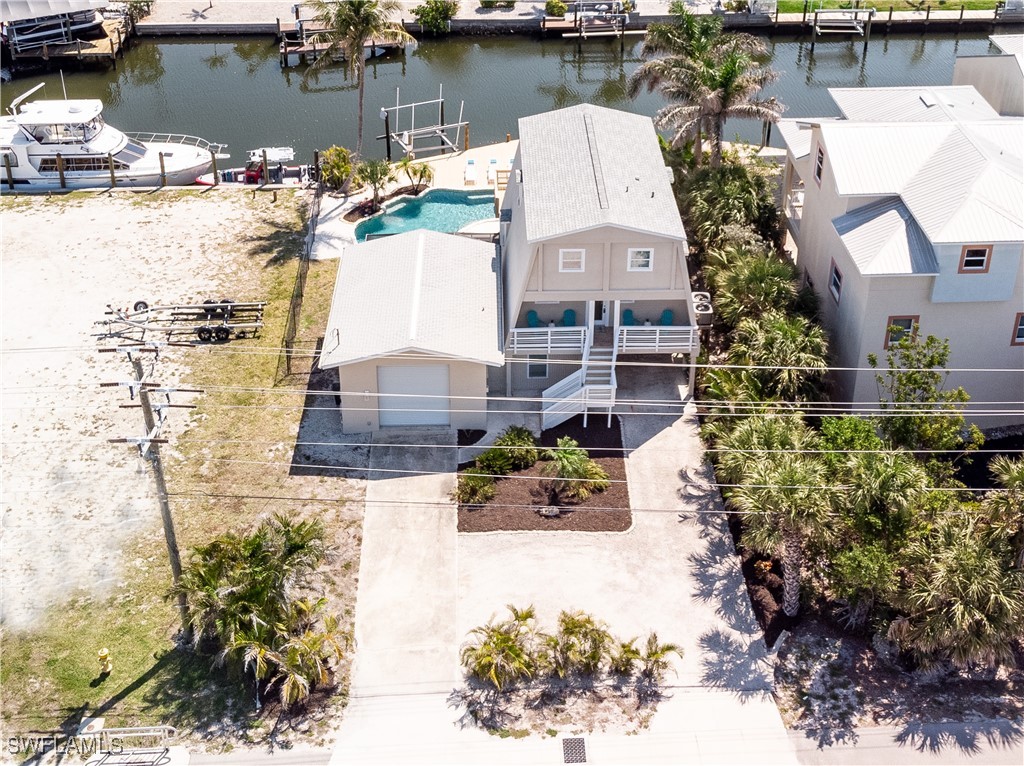 3128 Stringfellow Road St. James City, FL 33956 - Photo 49 of 50 a aerial view of a house with a lake view