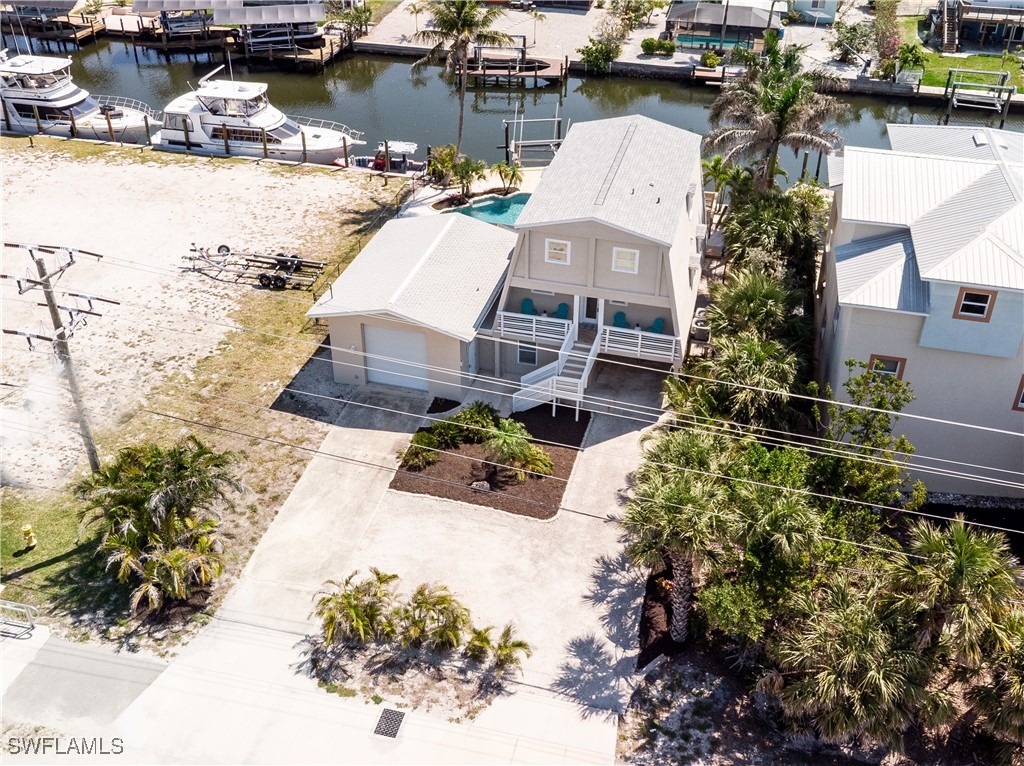 3128 Stringfellow Road St. James City, FL 33956 - Photo 7 of 50 a view of a lake with a house