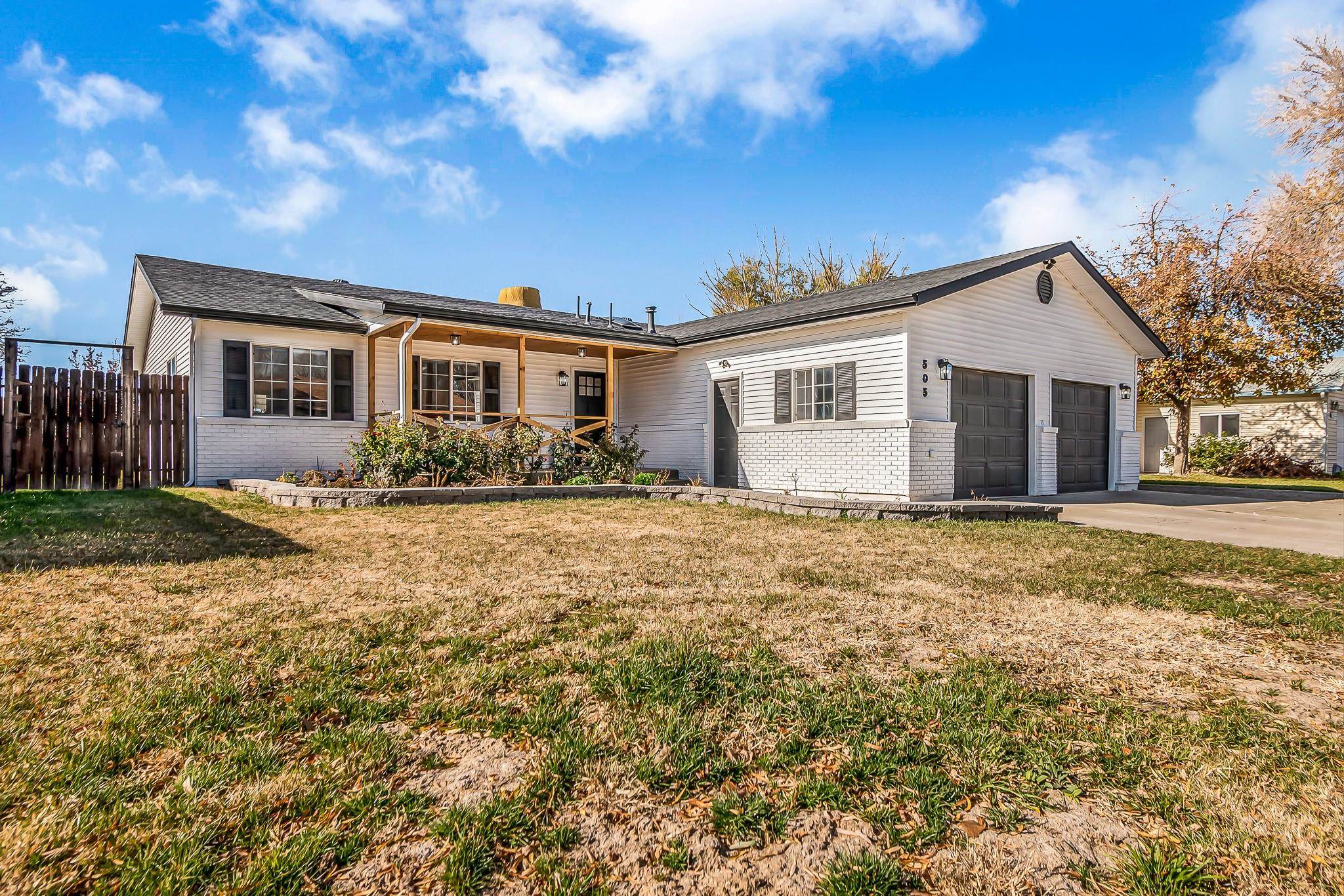 505 North Oak Street Fruita, CO 81521 - Photo 1 of 21 a front view of house with yard and trees around
