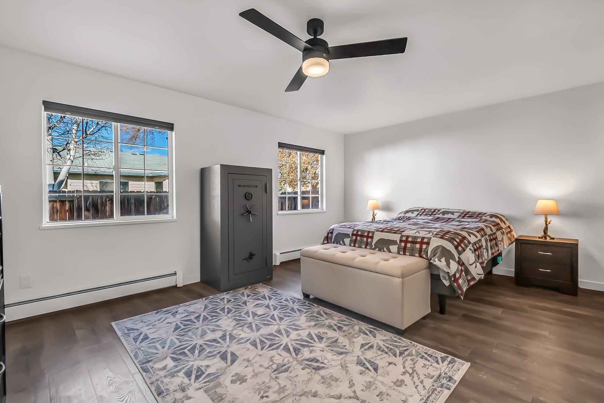505 North Oak Street Fruita, CO 81521 - Photo 13 of 21 a bedroom with a large bed and a window
