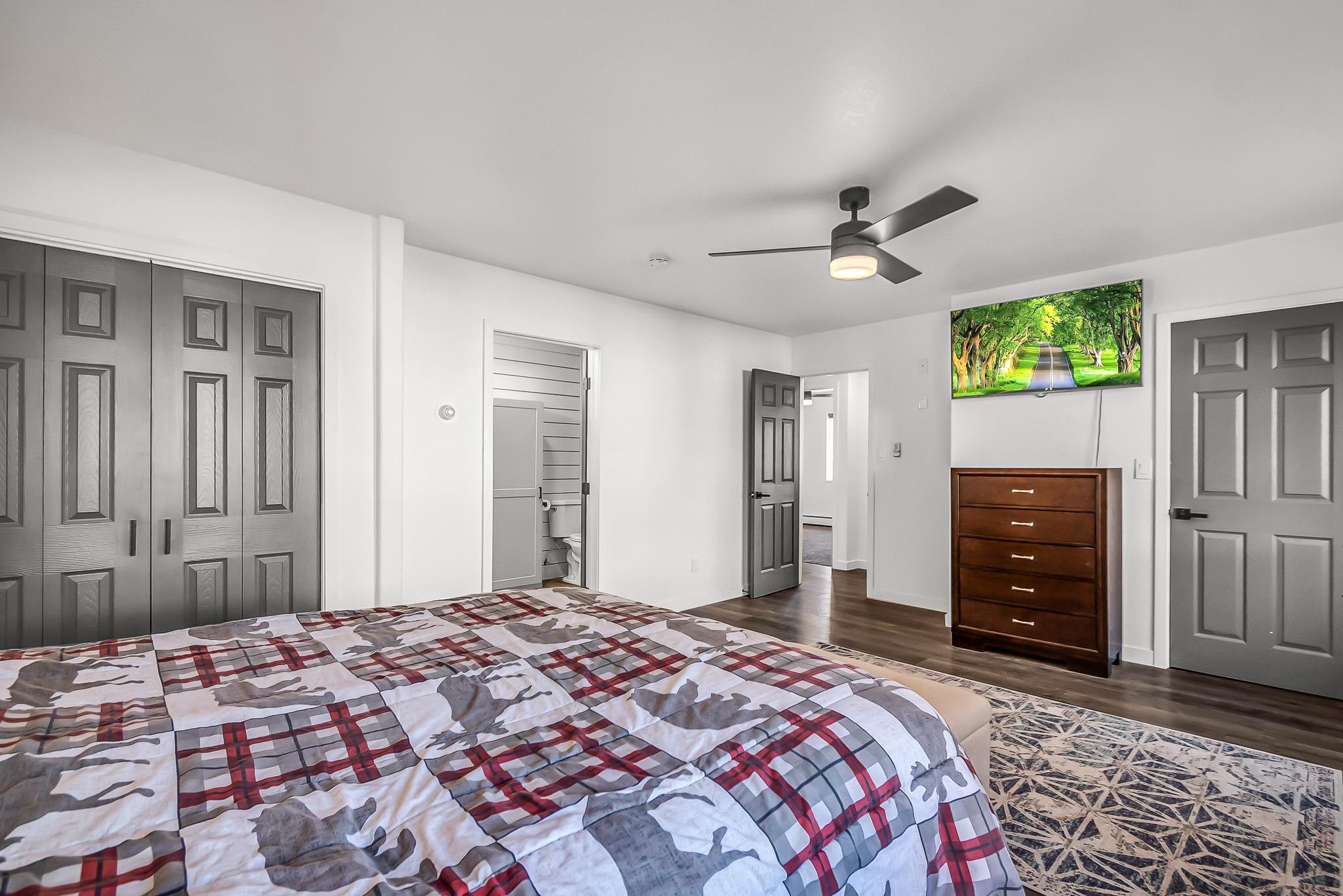 505 North Oak Street Fruita, CO 81521 - Photo 14 of 21 a bedroom with a bed dresser and a window