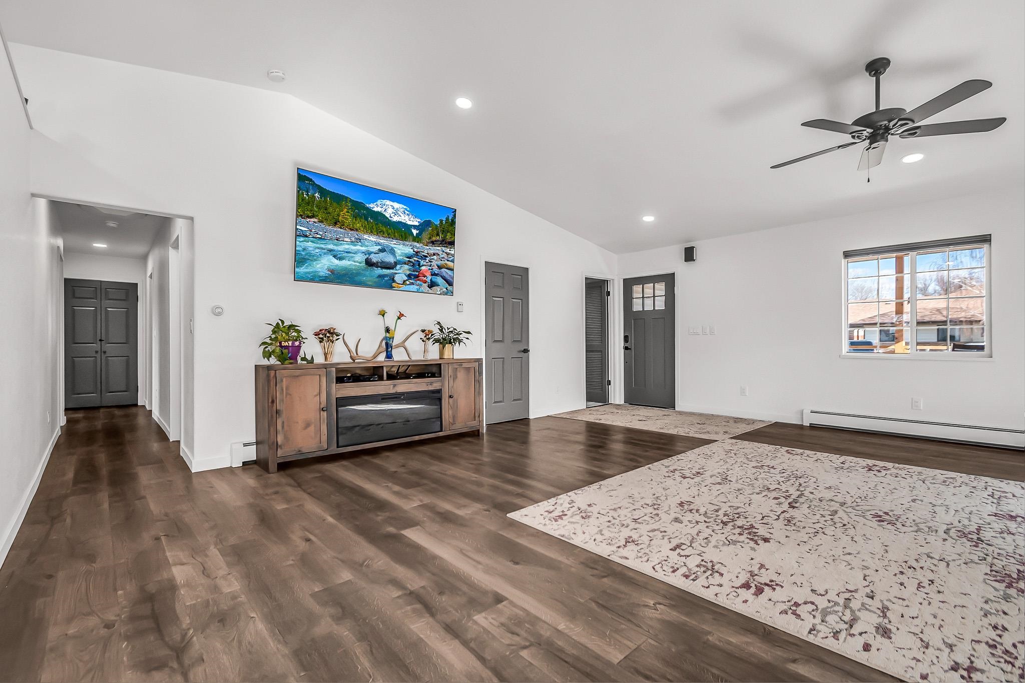 505 North Oak Street Fruita, CO 81521 - Photo 6 of 21 a view of a livingroom with wooden floor and a ceiling fan