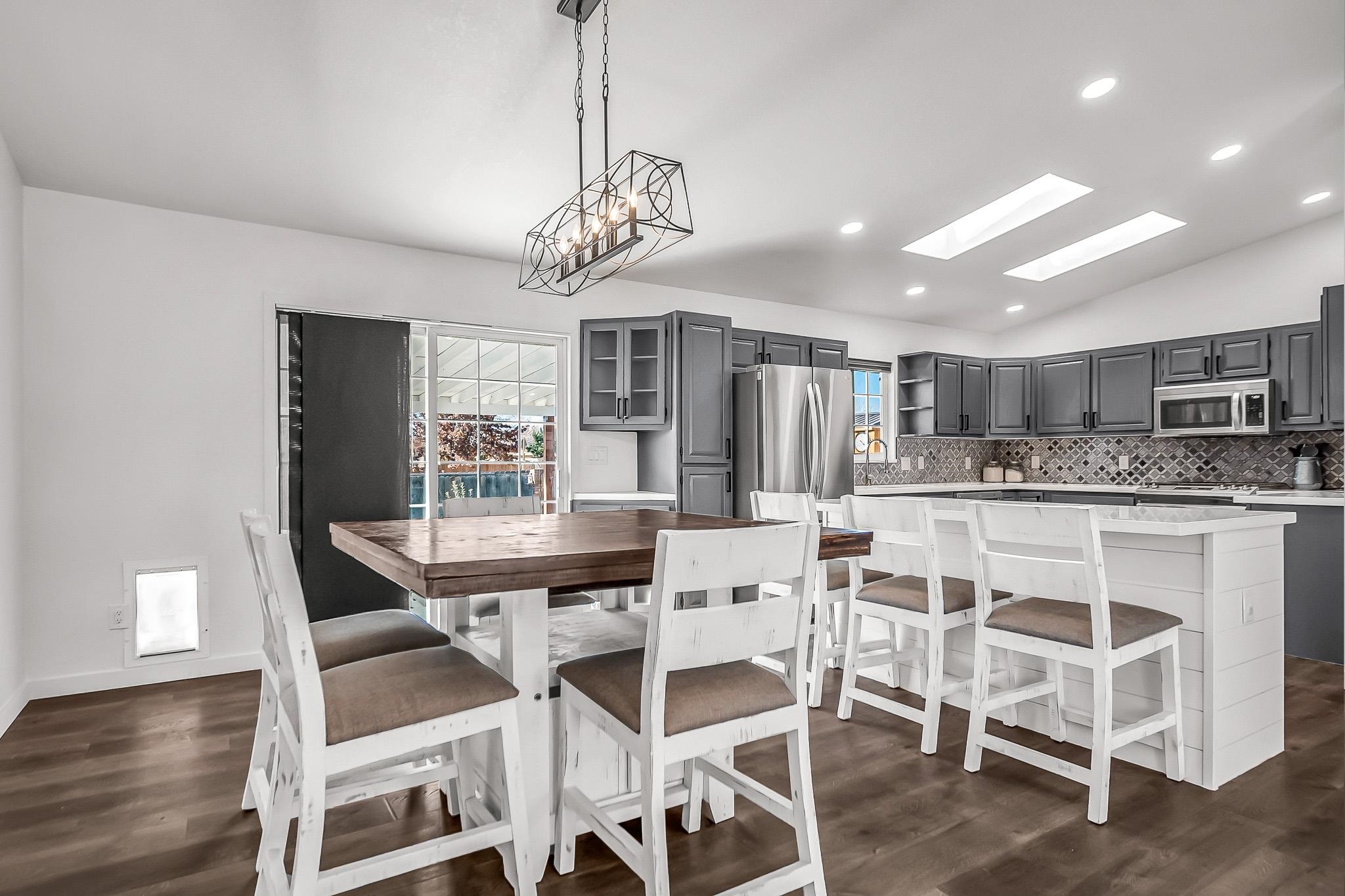 505 North Oak Street Fruita, CO 81521 - Photo 7 of 21 a view of a dining room with furniture wooden floor and chandelier