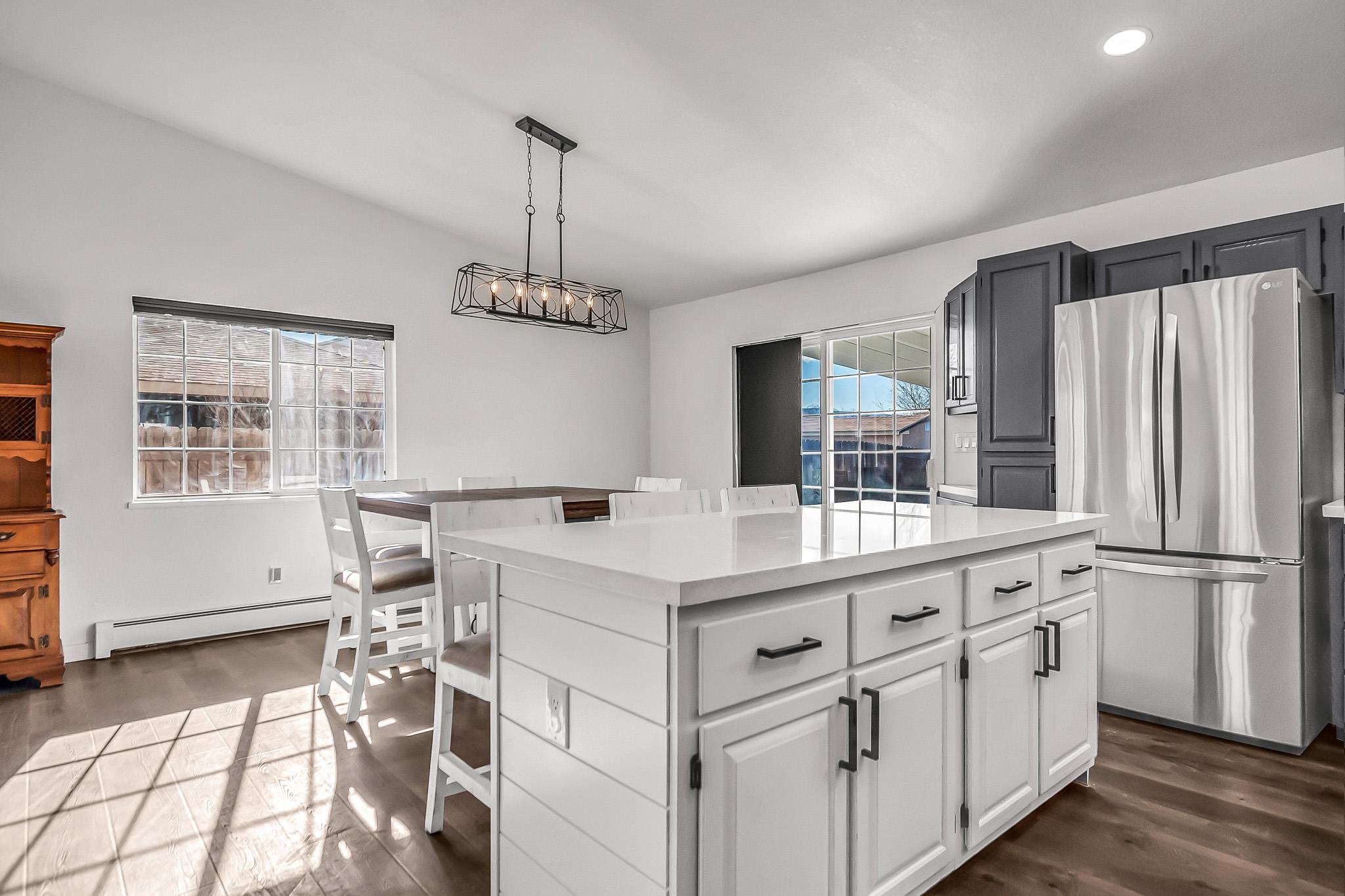505 North Oak Street Fruita, CO 81521 - Photo 8 of 21 a kitchen with white cabinets and white appliances