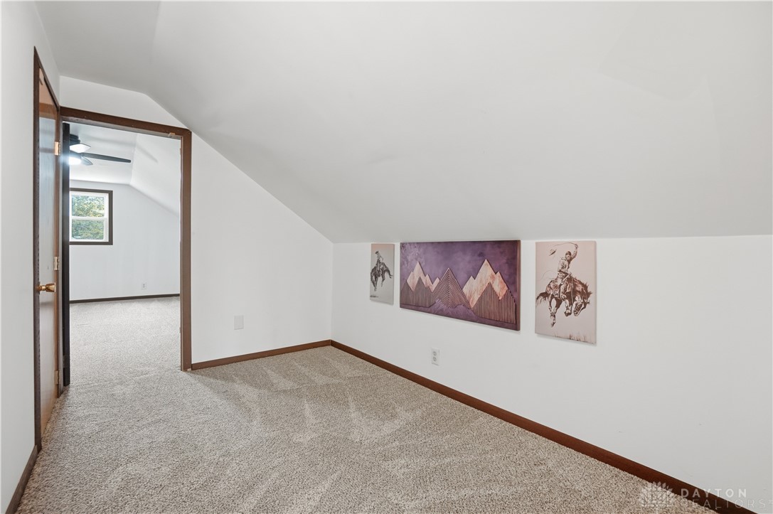 7553 Coffin Station Road Springfield, OH 45502 - Photo 62 of 95 Bright and airy, this carpeted attic space offers versatile living options.