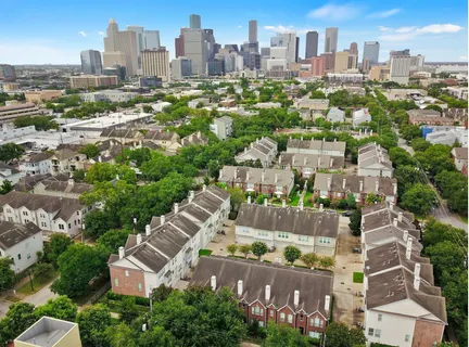 an aerial view of a city with lots of residential buildings