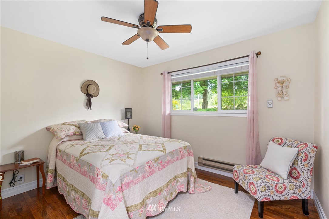 105 Ribelin Road Chehalis, WA 98532 - Photo 12 of 27 a bedroom with a bed a couch and a window