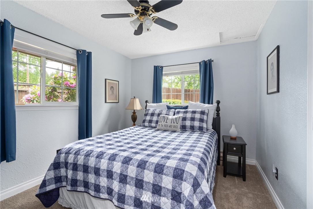 105 Ribelin Road Chehalis, WA 98532 - Photo 18 of 27 a bed sitting in a bedroom next to a window