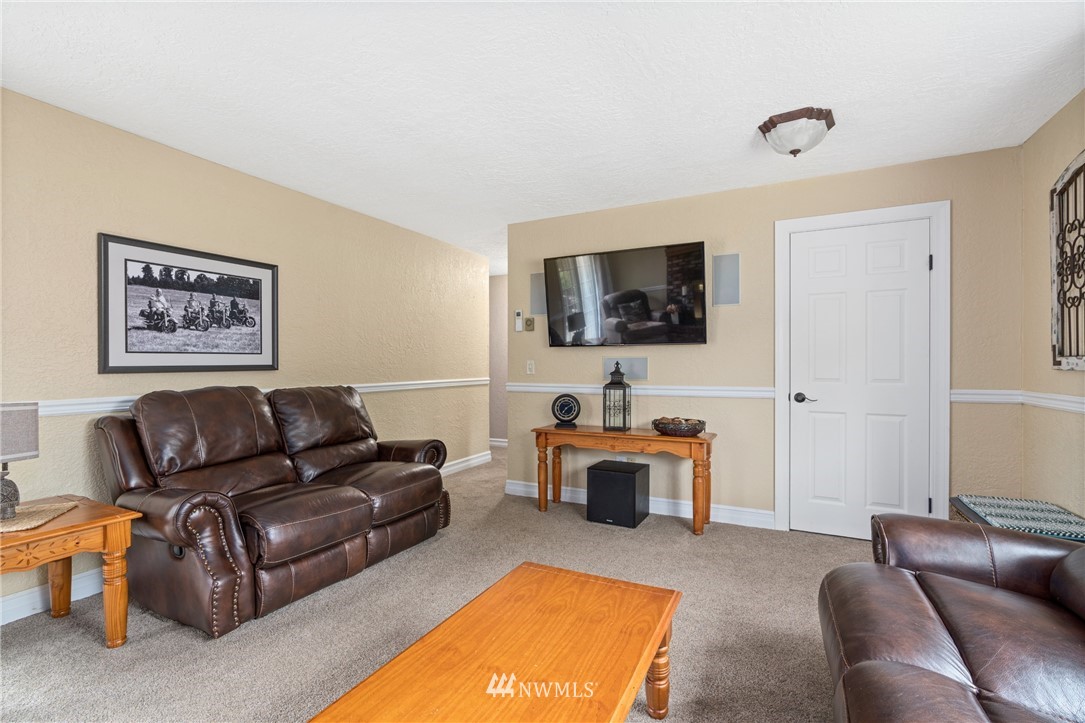 105 Ribelin Road Chehalis, WA 98532 - Photo 20 of 27 a living room with furniture and a flat screen tv