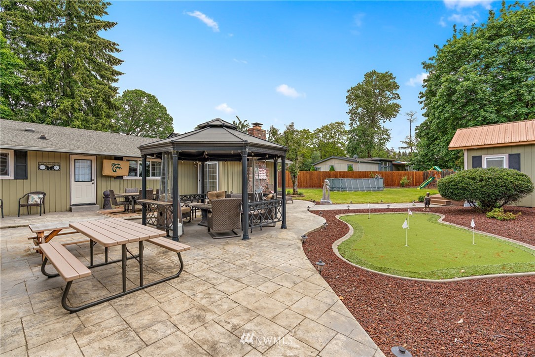 105 Ribelin Road Chehalis, WA 98532 - Photo 21 of 27 a view of a swimming pool with chairs in patio