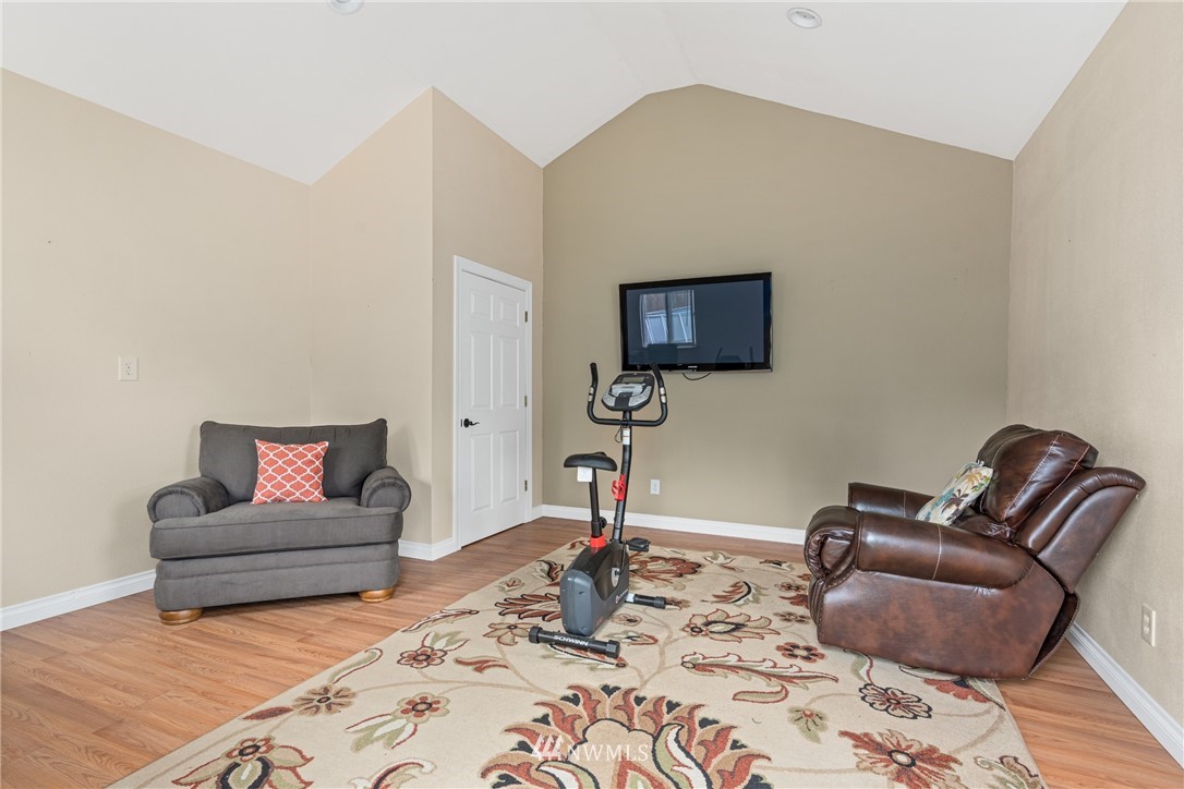 105 Ribelin Road Chehalis, WA 98532 - Photo 24 of 27 a living room with furniture and a flat screen tv