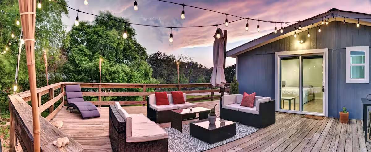 8807 High Valley Road Austin, TX 78737 - Photo 16 of 22 Unwind on this spacious deck, ideal for evening gatherings and serene outdoor moments.