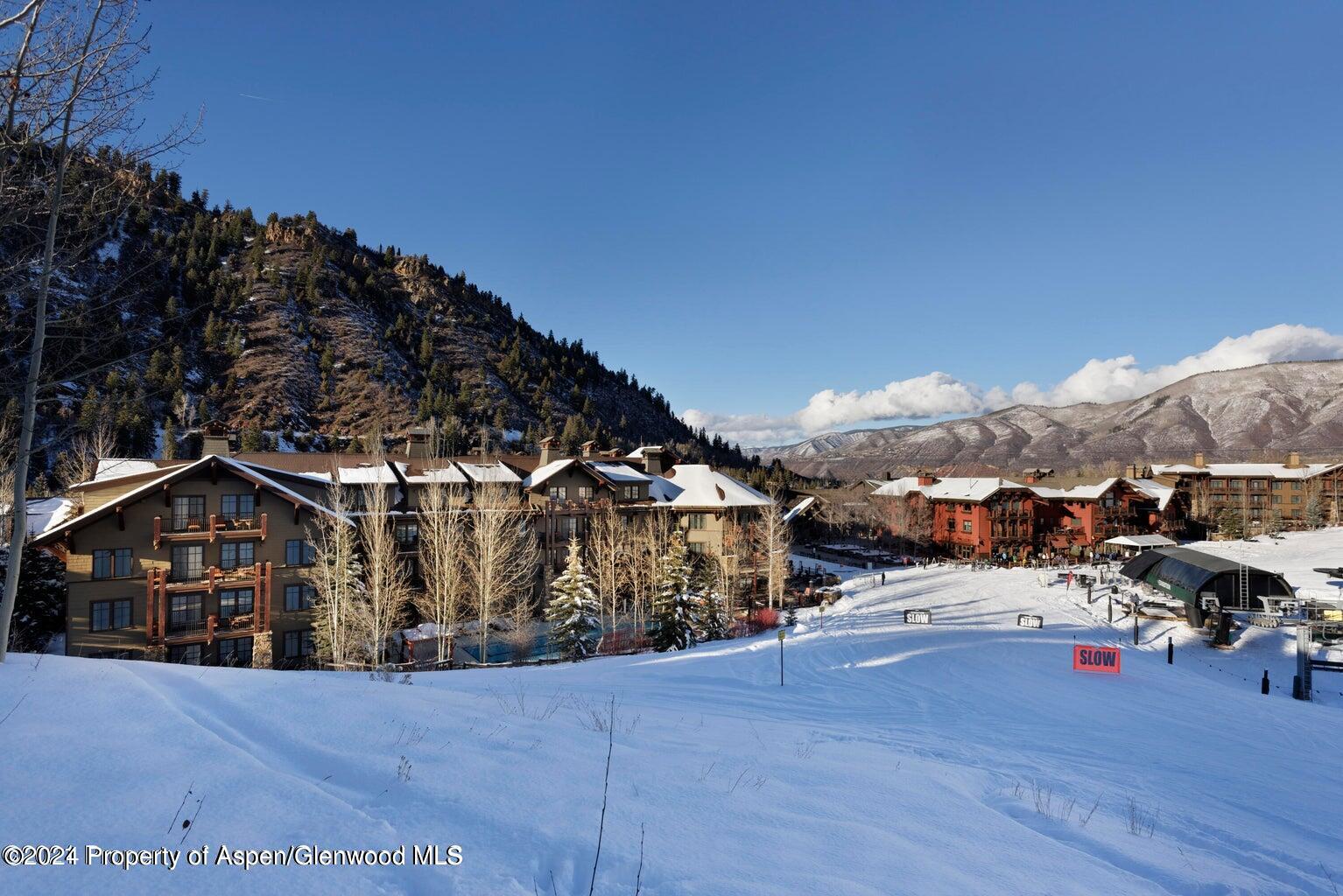75 Prospector Road, Unit 840610 Aspen, CO 81611 - Photo 28 of 29 a view of a house next to a road