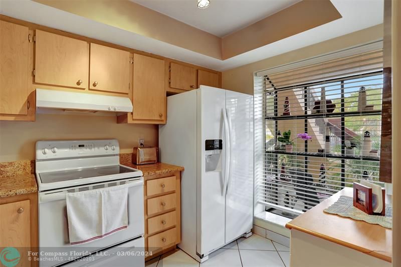 a kitchen with appliances and cabinets
