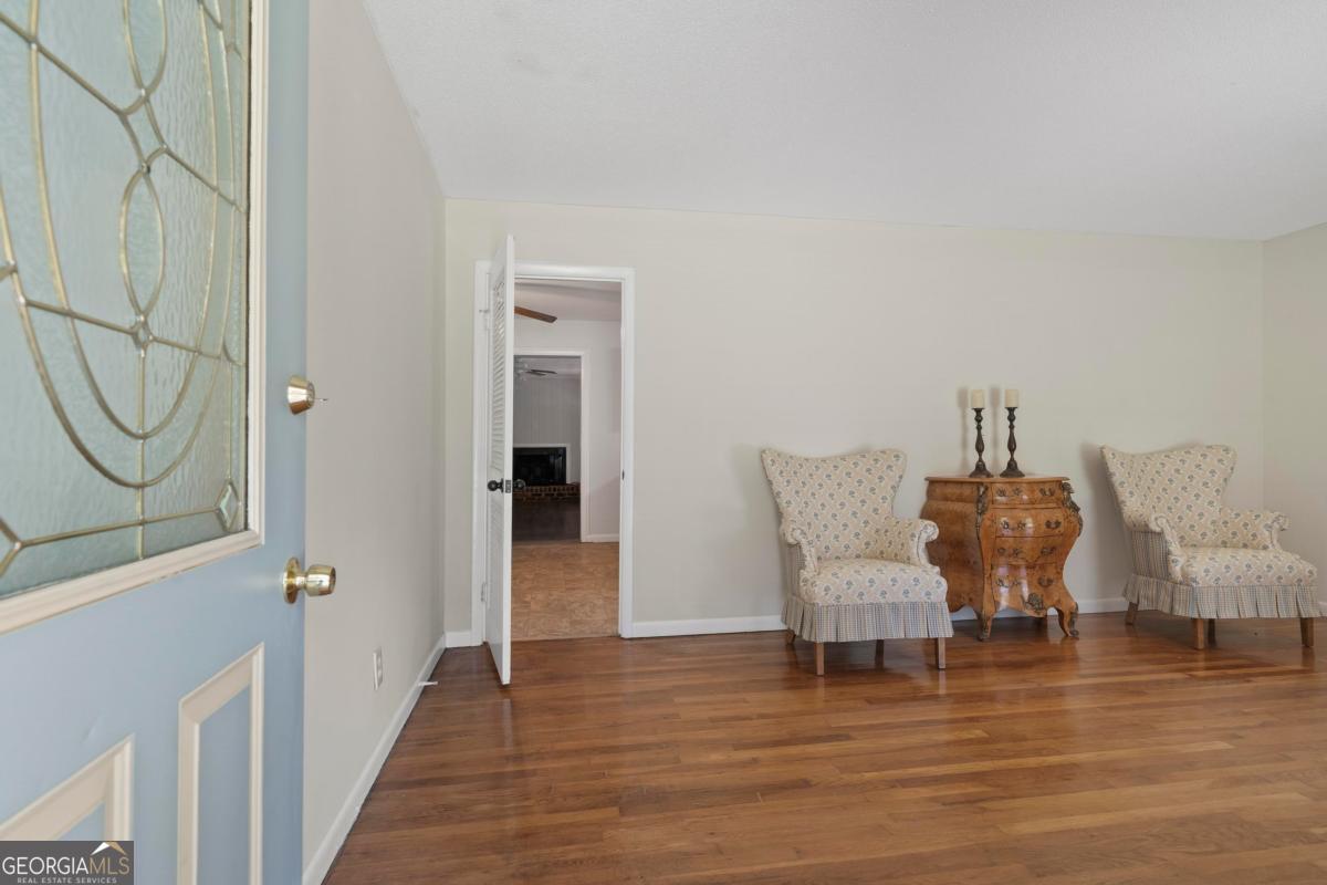 3021 Penfield Road Greensboro, GA 30642 - Photo 12 of 50 a chair and a table in a room