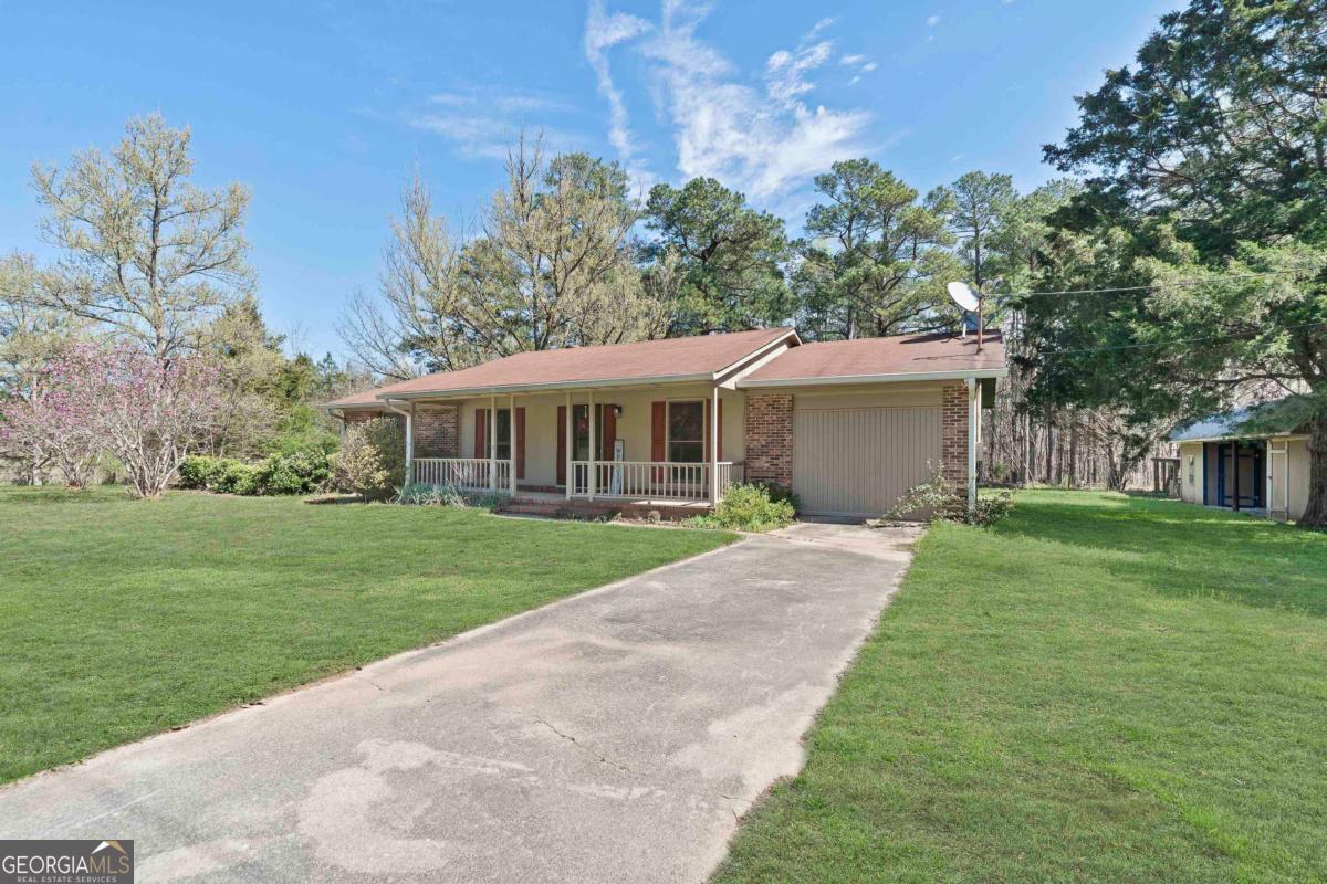 3021 Penfield Road Greensboro, GA 30642 - Photo 2 of 50 a view of a house with a yard