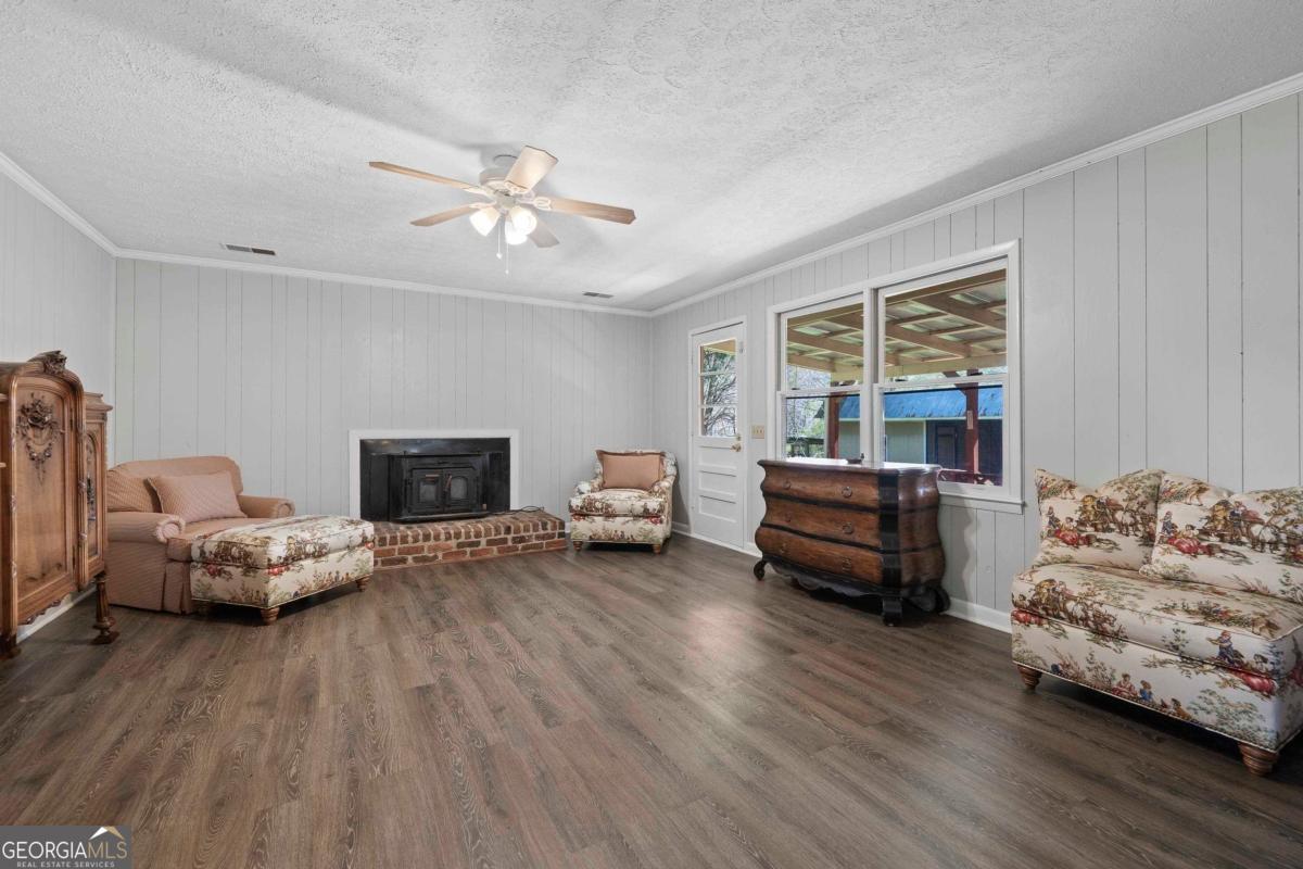3021 Penfield Road Greensboro, GA 30642 - Photo 26 of 50 a bedroom with furniture and wooden floor